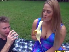 Curvy milf Holly is dangerously sexy in her blue summer dress. her dress can't hide her big soaked tits. This babe eats banana sexy in front of MILF Hunter and then flashes her bald pussy. Watch her turn him on outdoors